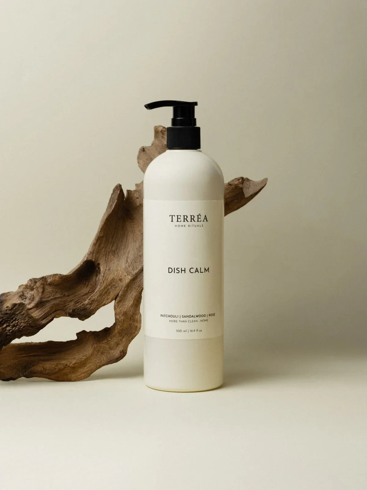 Dish Calm eco-friendly dish soap with patchouli, sandalwood, rose scents, minimalist white bottle with black pump