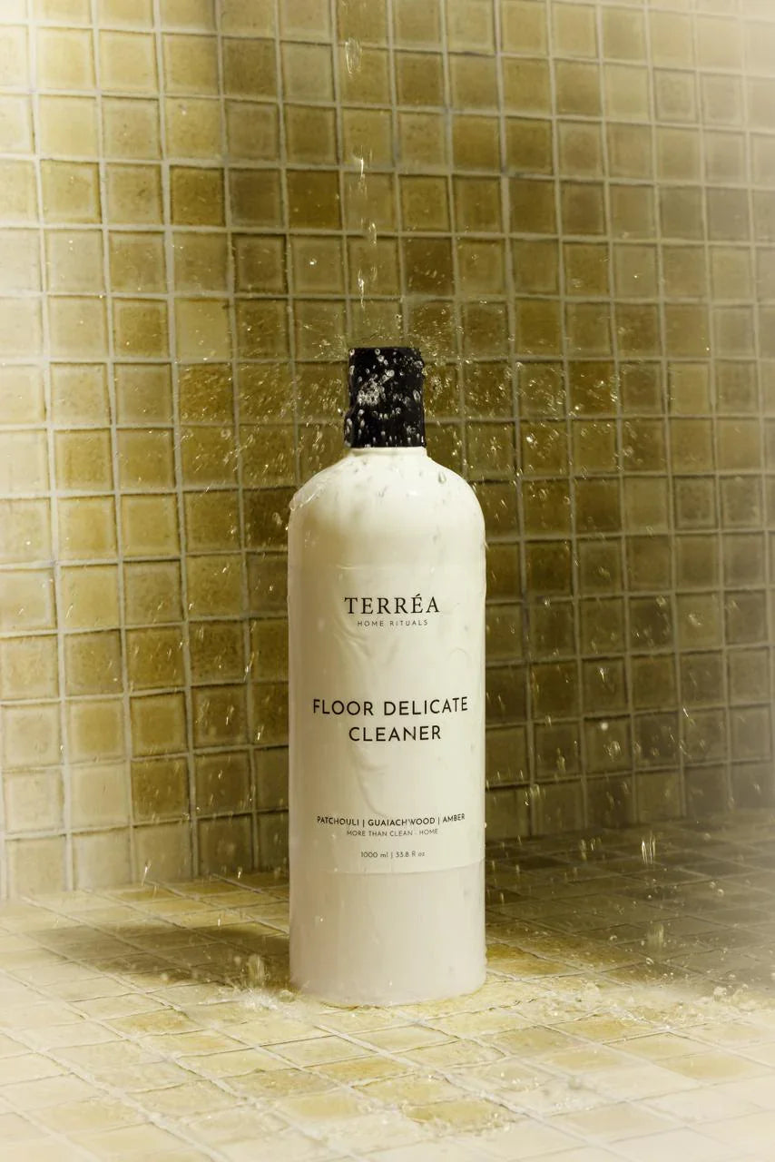 Bottle of Terrea Floor Delicate Cleaner against a tiled wall background