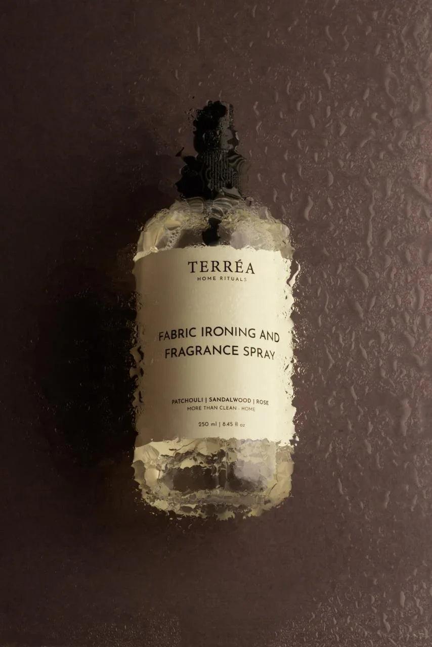 TERRÉA Fabric Ironing & Fragrance Spray with Patchouli, Sandalwood, Rose scent on misty surface