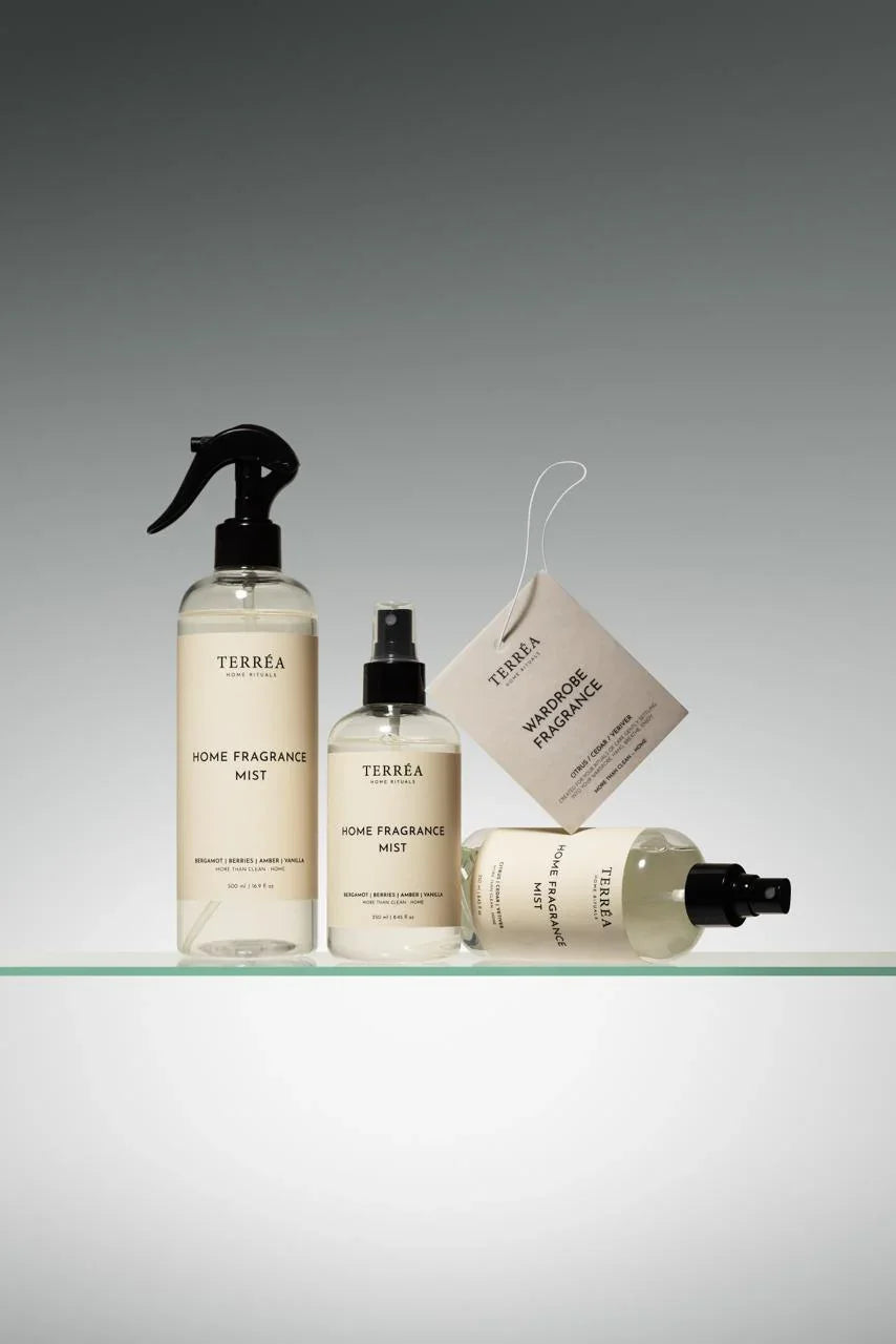 Elegant home fragrance mists and wardrobe spray in minimalist bottles, featuring natural scents for sustainable luxury home rituals