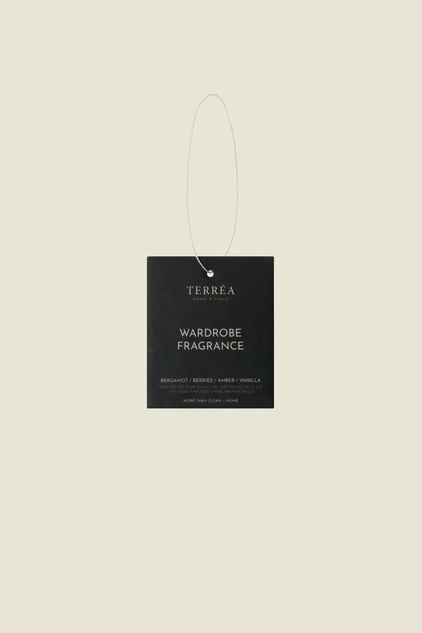 Terréa Wardrobe Fragrance Bergamot, Berries & Amber, green sachet on white background.