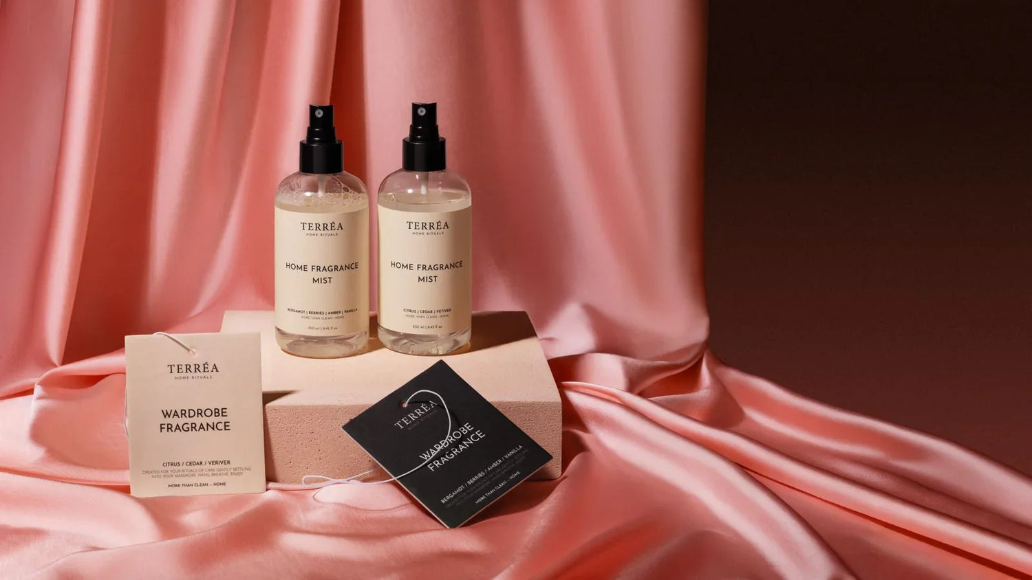 Terréa Home Fragrance Mists and Wardrobe Fragrance tags styled on blush satin