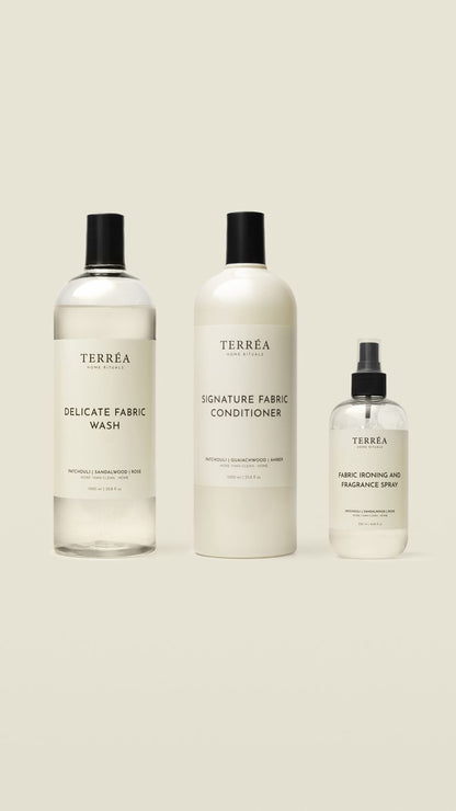 Three bottles of Terrea fabric care products on a white background
