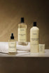 Set of Terrea fabric care products including a spray bottle, liquid soap, and conditioner on a neutral background.