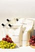 Terréa refill pouches for Dish Calm, Clean Home Surfaces and Floor Delicate Cleaner styled with red and green grapes in warm sunlight.