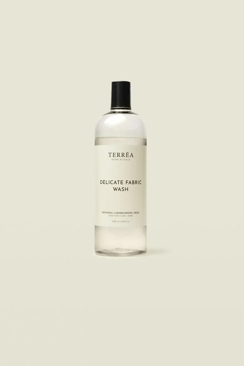 Bottle of Terrea Delicate Fabric Wash on a beige background