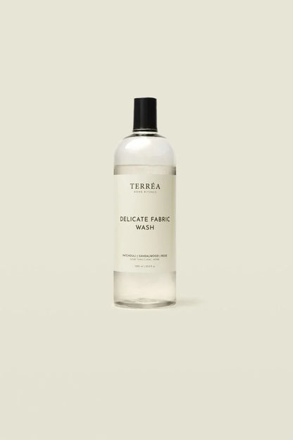 Bottle of Terrea Delicate Fabric Wash on a beige background