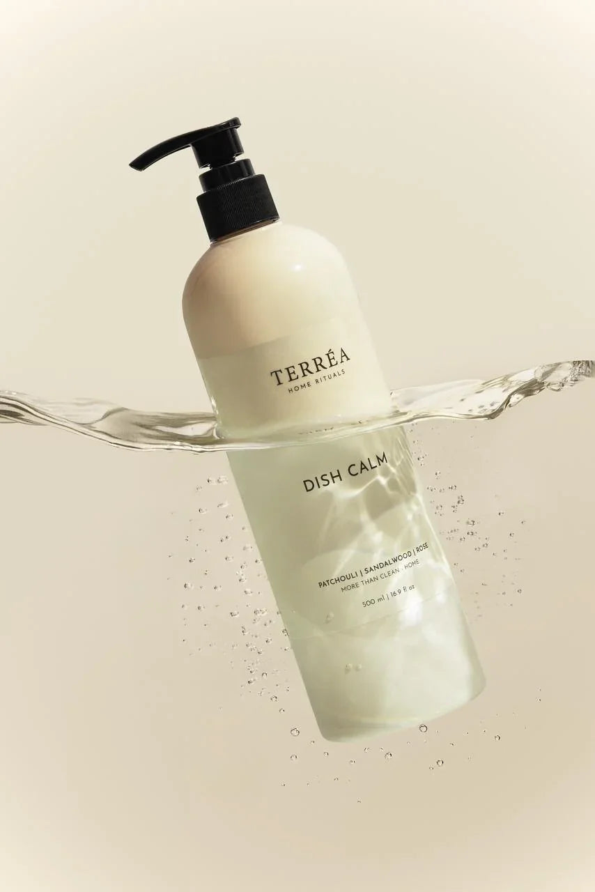 Terrea Dish Calm bottle with water splash on a beige background