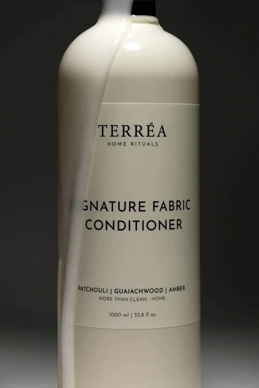 Bottle of Terreéa Home Rituals Signature Fabric Conditioner on a dark background
