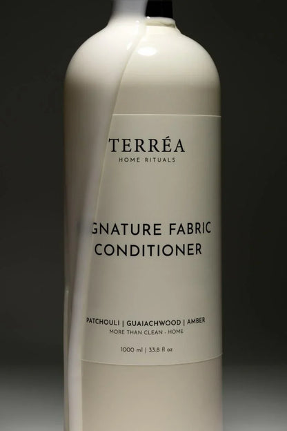 Bottle of Terreéa Home Rituals Signature Fabric Conditioner on a dark background