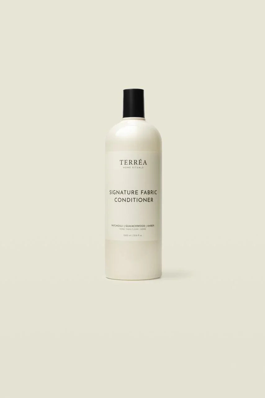 Bottle of Terrea Signature Fabric Conditioner on a beige background