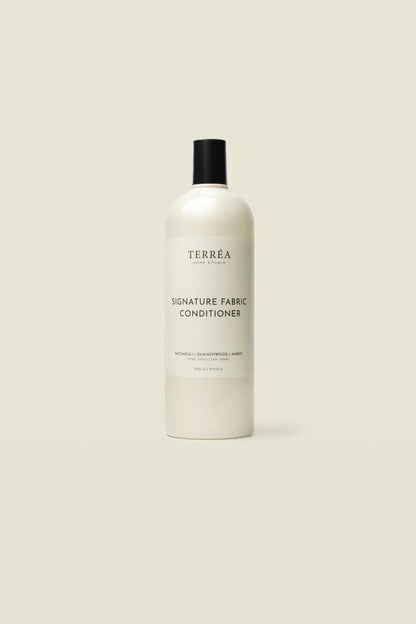 Bottle of Terrea Signature Fabric Conditioner on a beige background