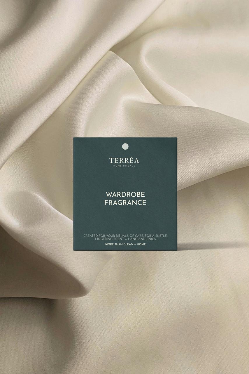 Terreéa wardrobe fragrance card on beige fabric
