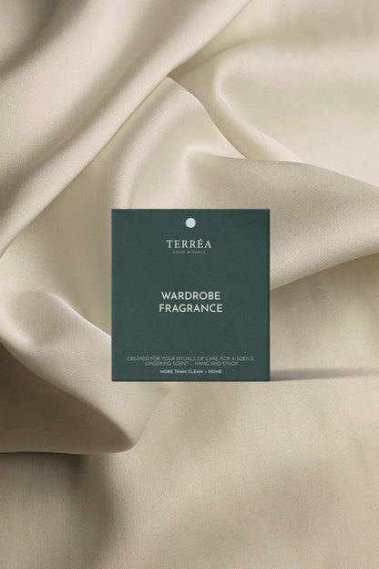 Terreéa wardrobe fragrance card on beige fabric