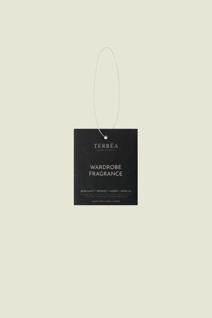 Terréa Wardrobe Fragrance Bergamot, Berries &amp; Amber, green sachet on white background.