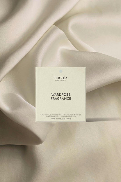 Terrea Wardrobe Fragrance packaging on beige fabric