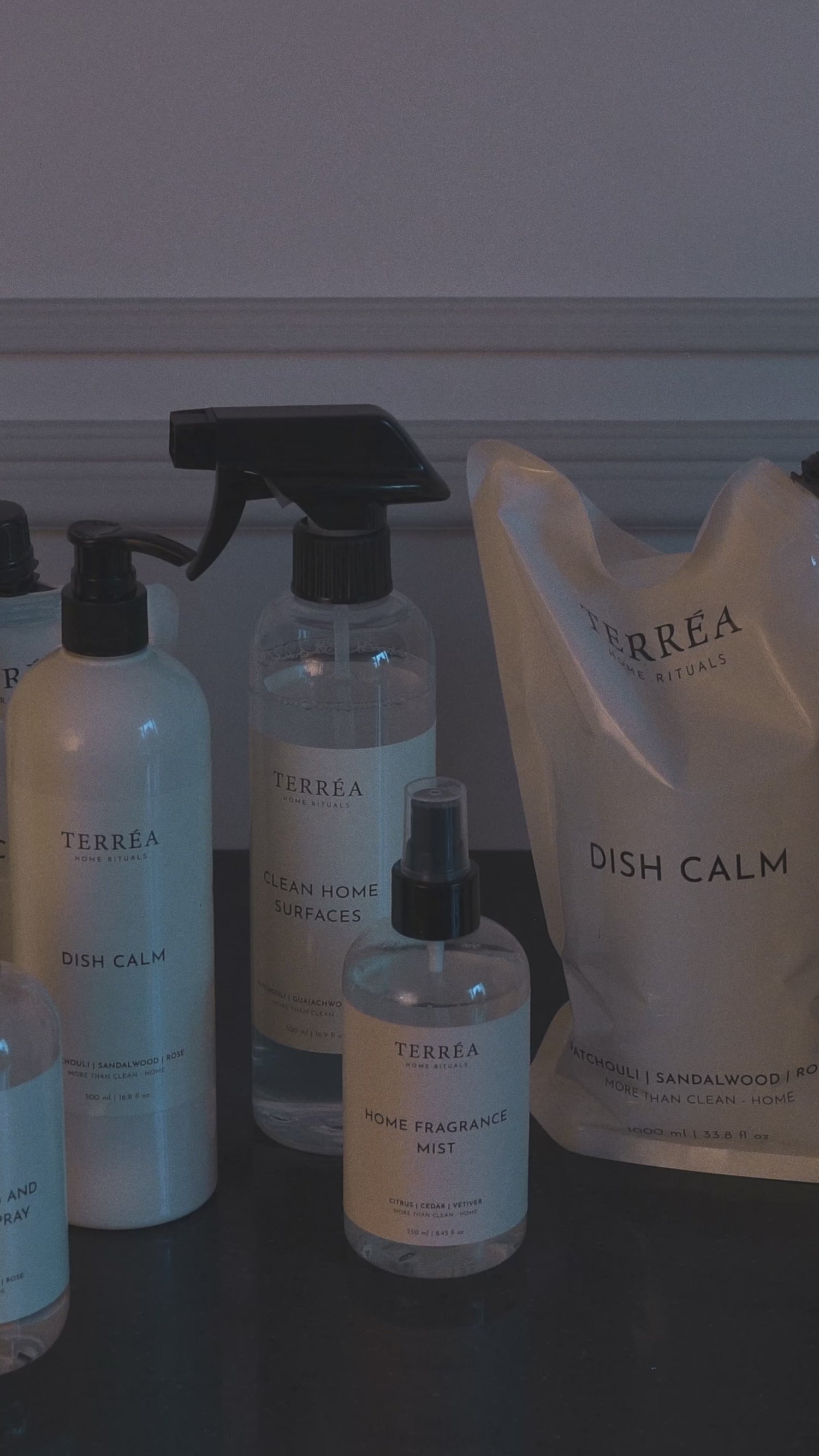 Terréa refill - matte pouch pouring into the original bottle; spout-to-neck fit for a steady, clean, no-mess ritual.