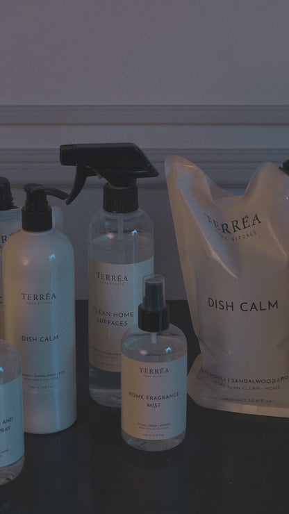 Terréa refill - matte pouch pouring into the original bottle; spout-to-neck fit for a steady, clean, no-mess ritual.