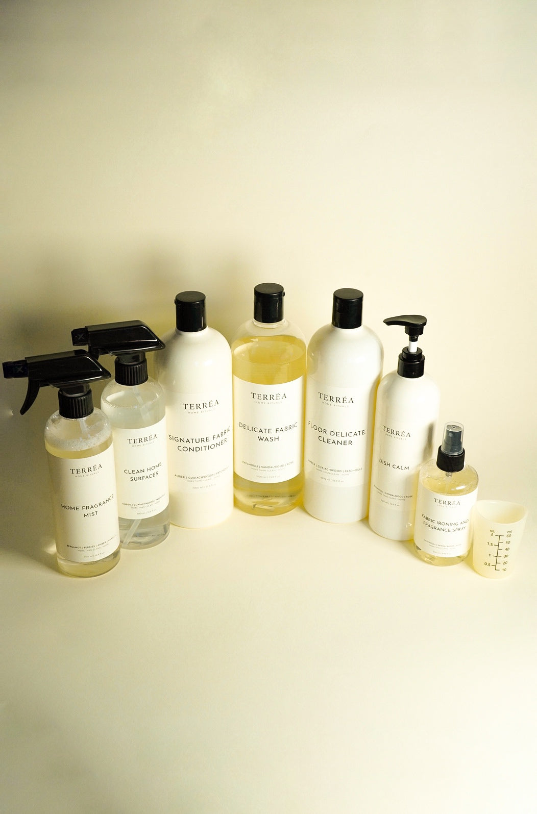 Terréa bottles for every room of the house, lined up on a cream background